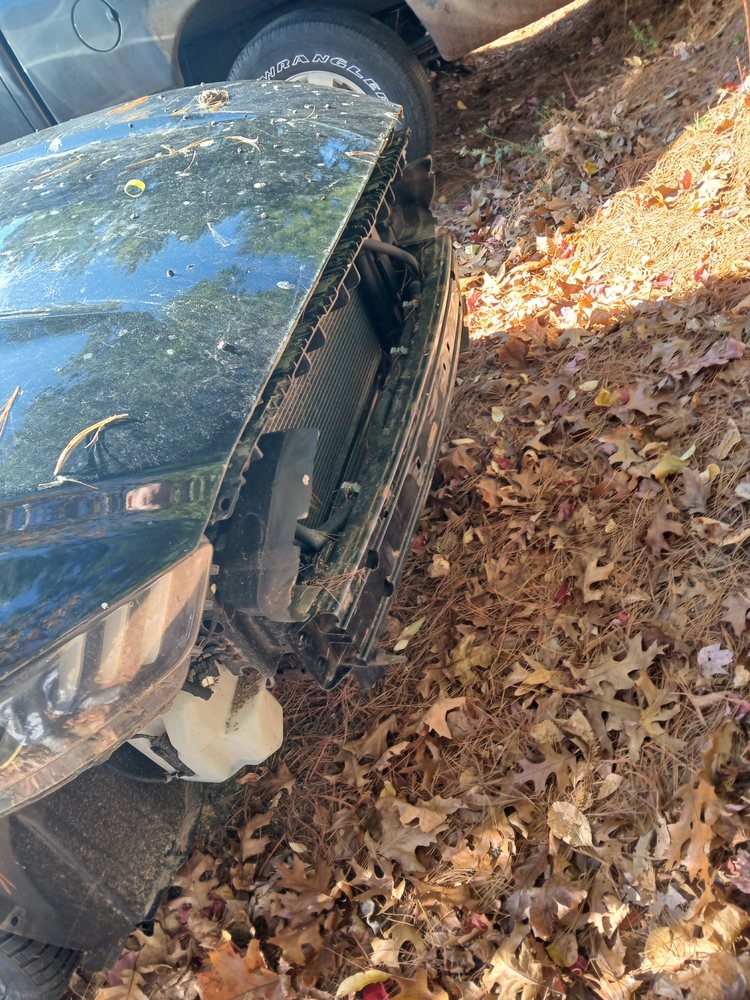 SUV front end with radiator exposed for repair