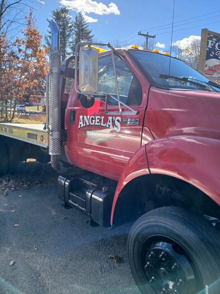 Close-up of the Angela's flatbed in front of the FCC sign