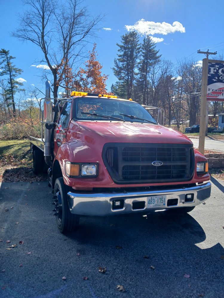 Flatbed tow truck ready to recover a vehicle