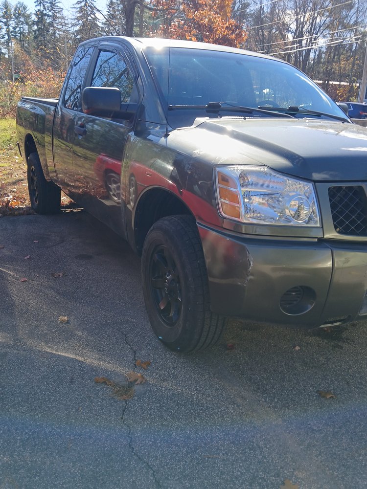 Nissan Titan with primer panels mid-repair